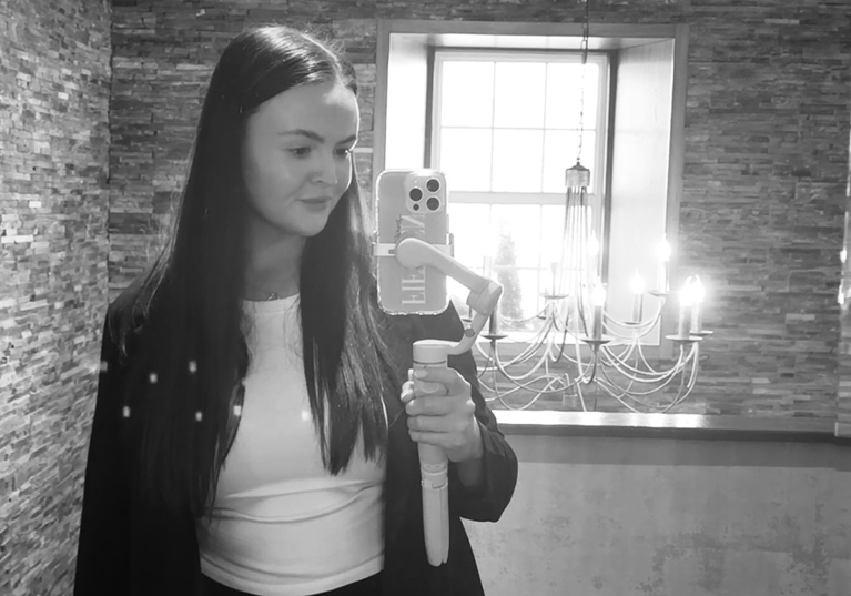 Black and white selfie of Fifteen Weddings & Events owner and wedding content creator Lianna